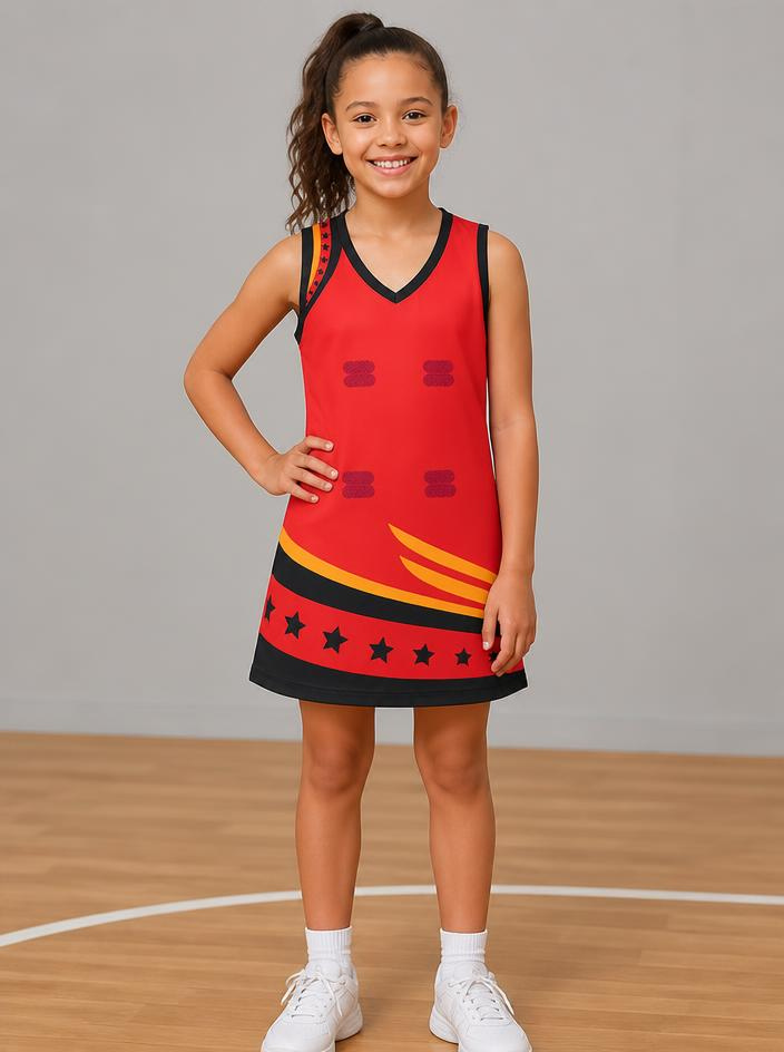 Junior MENC A-line dress in red, with black and gold trim and a band of stars around the hem